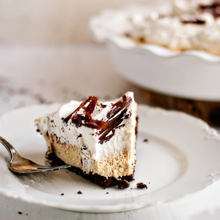 a slice of creamy peanut butter pie on a white plate