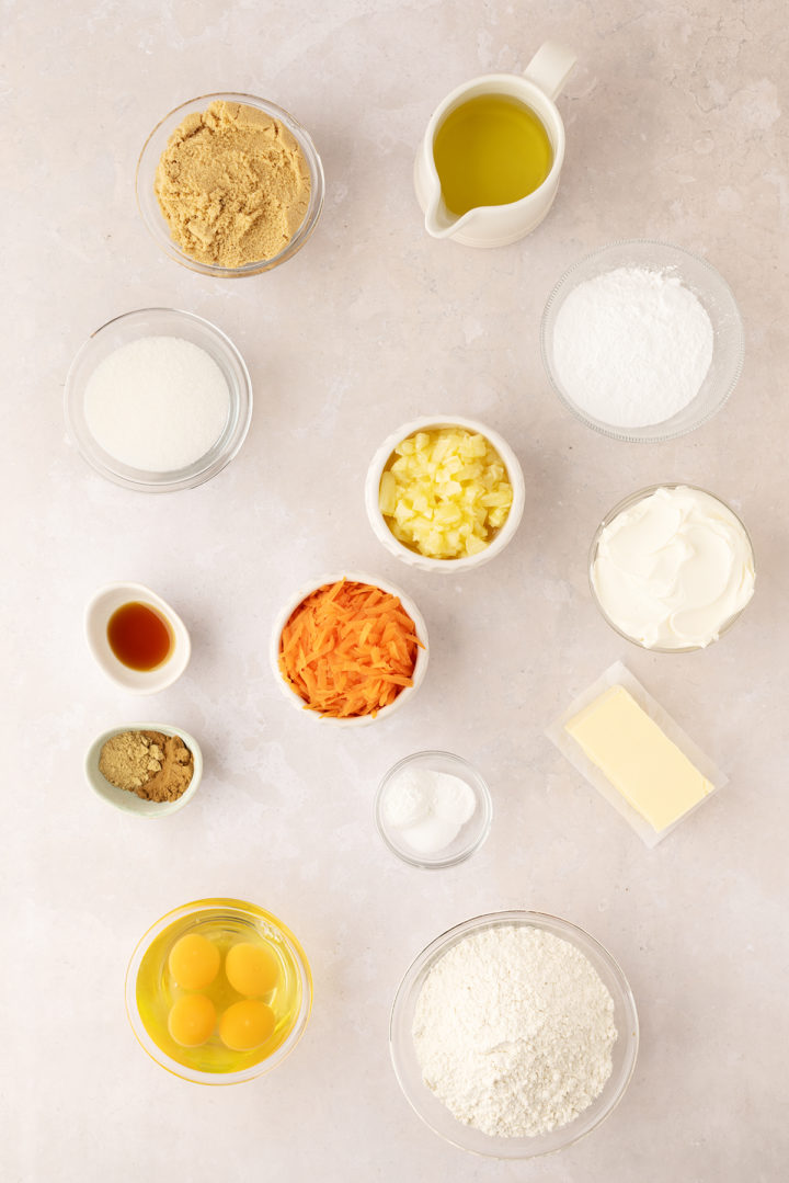 overhead photo of bowls containing ingredients needed to make carrot pineapple cake 