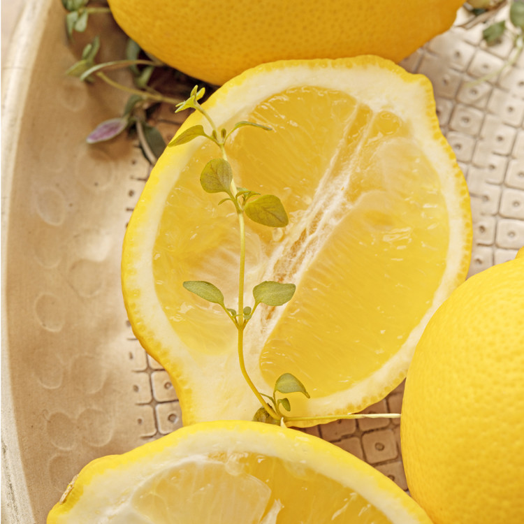 fresh lemons in a gold bowl