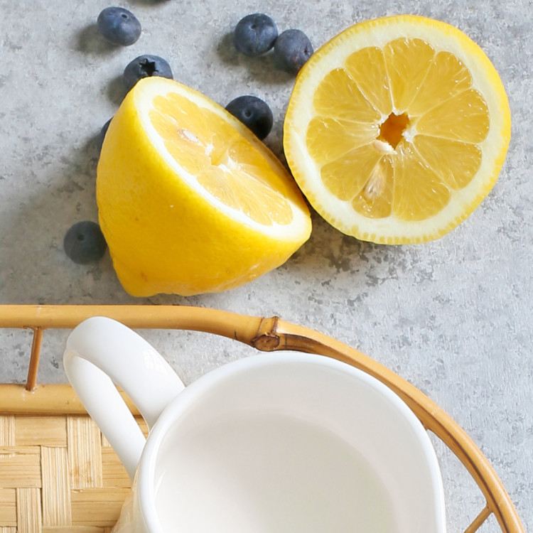 lemon cut in half with fresh bluberries