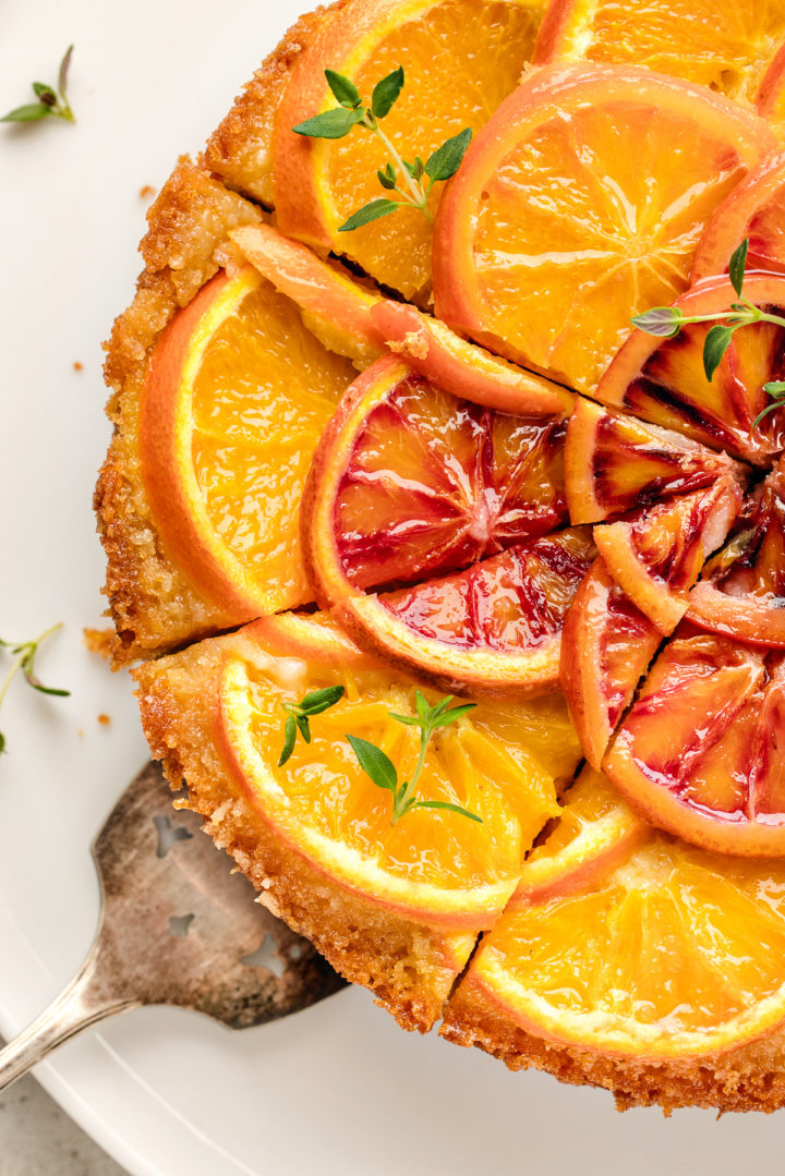 close up photos of slices of orange upside-down cake on a serving platter with a cake server utensil