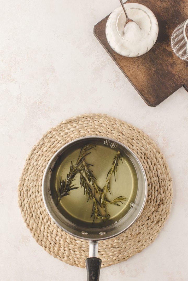 rosemary syrup in a stainless steel pot