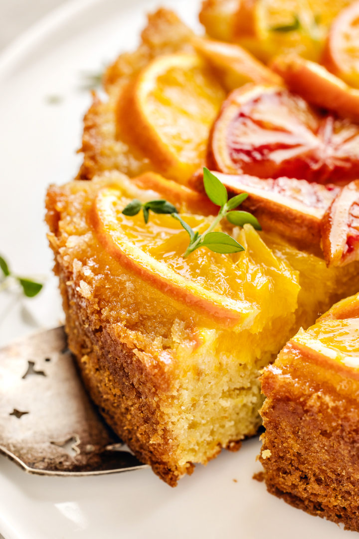 slice of upside down orange cake being served