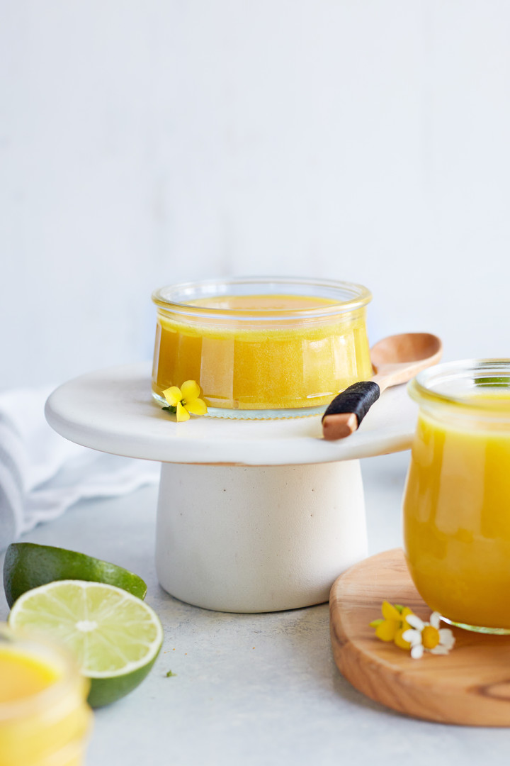 jar of lime curd on a white serving platter