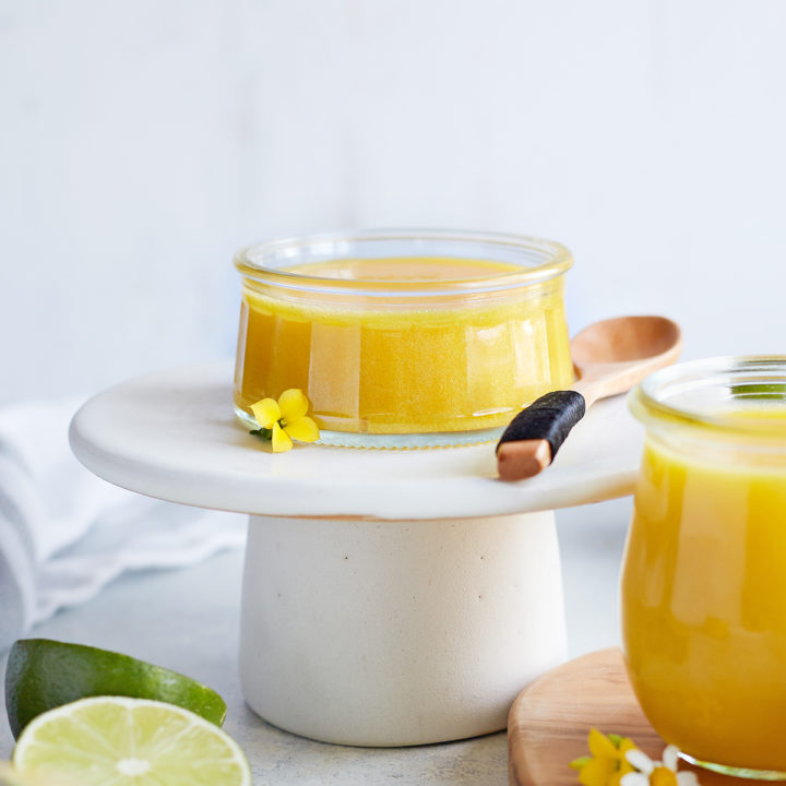 jar of lime curd on a white serving platter