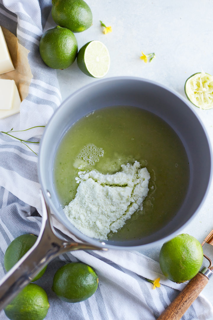 adding lime juice to sugar in a saucepan