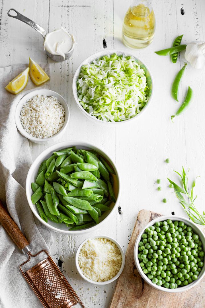 overhead photo of bowls of ingredients to make spring pea risotto