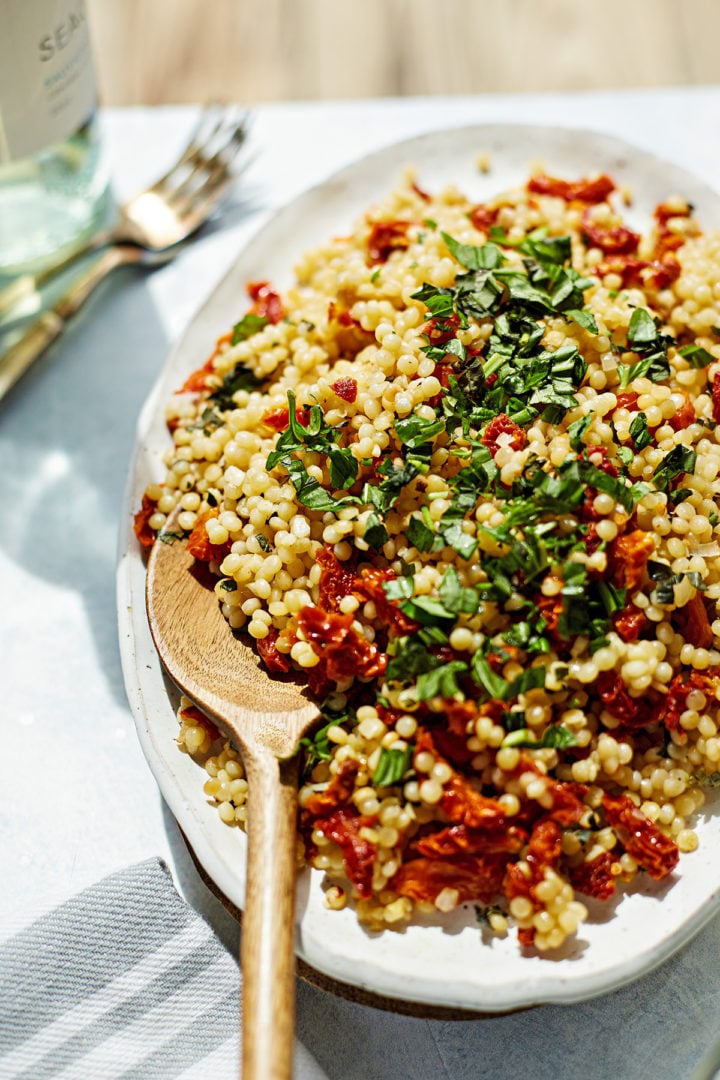 a table set with lemon couscous salad for a picnic