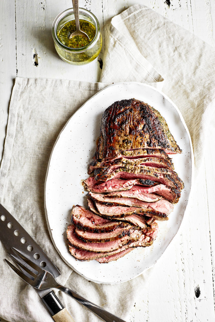 grilled chimichurri skirt steak on a platter