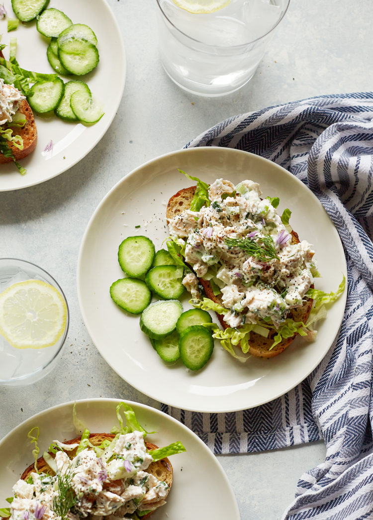 overhead photo of greek yogurt chicken salad with green apples on white plates