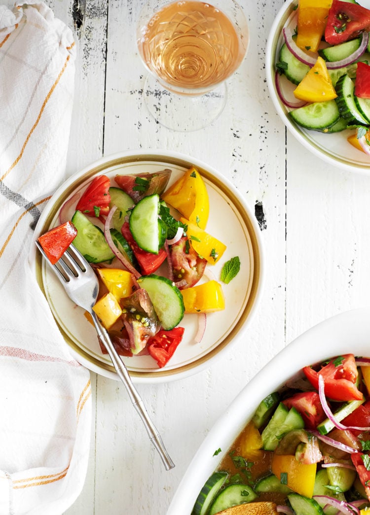 plates of tomato cucumber salad