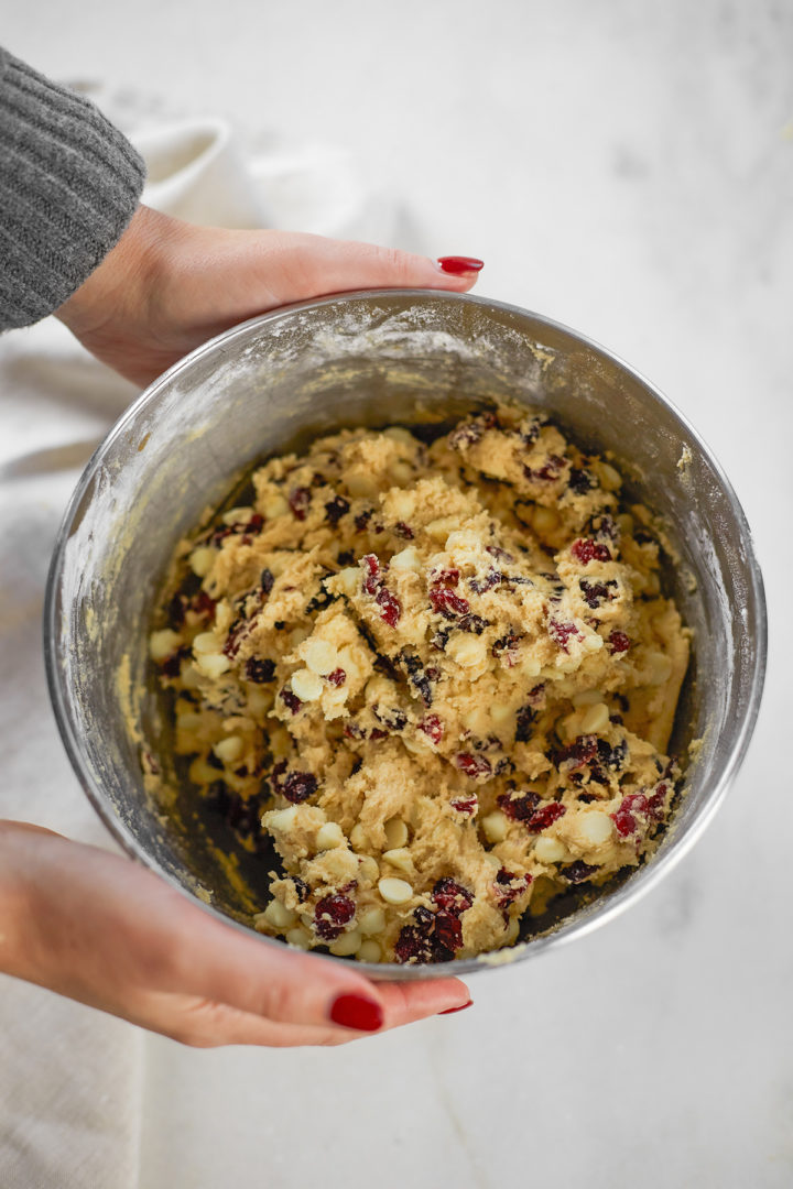 Woman holding bowl of cookie dough