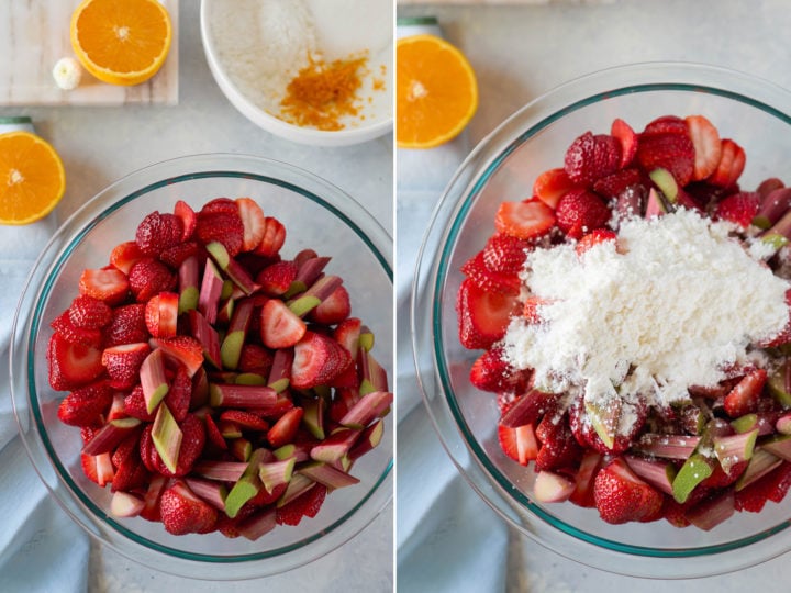Two glass mixing bowls shown side-by-side. The left bowl is filled with sliced fresh strawberries and rhubarb, and the right bowl shows the same mixture with a mound of white sugar on top. Orange halves and zest are visible in the background.