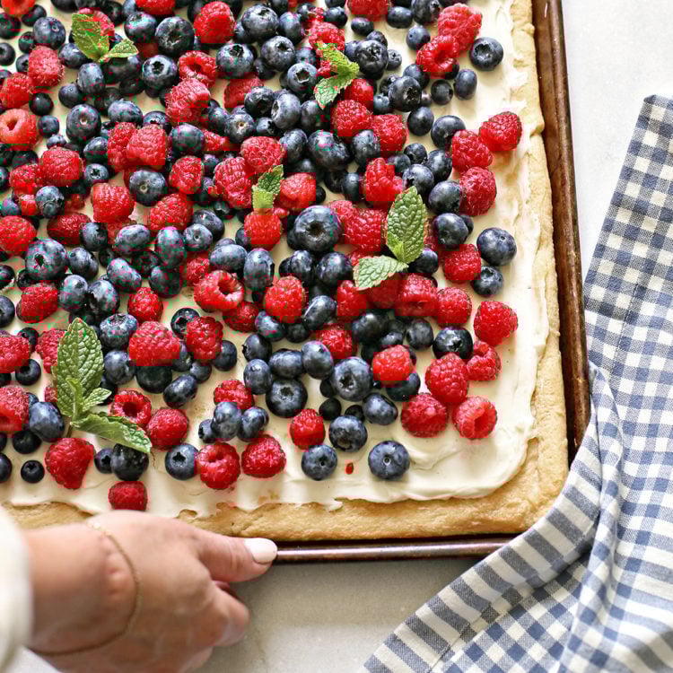 woman holding a tray of 4th of July dessert