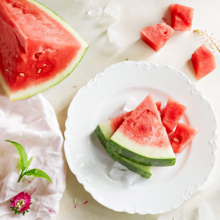 sliced watermelon on a white plate