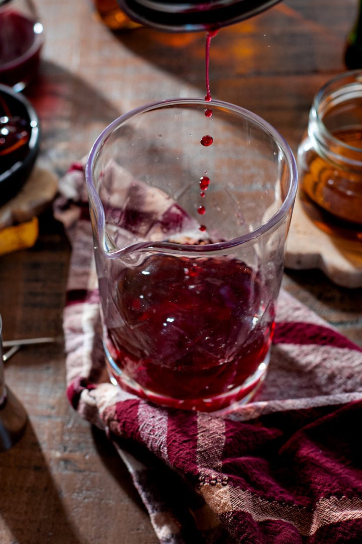 Building a Christmas Manhattan in a cocktail mixing glass. 