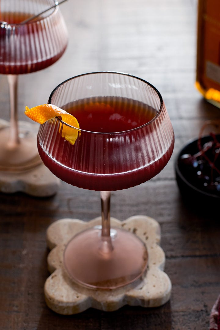 A Christmas Manhattan in a coupe glass. 