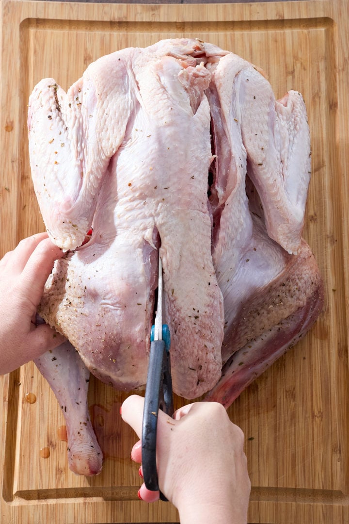Removing the backbone from a turkey.