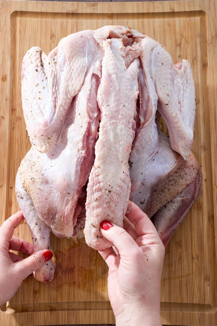 Removing the backbone from a turkey.