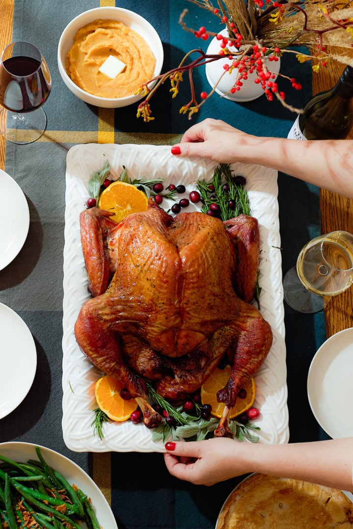 A spatchcock smoked turkey on a serving platter.