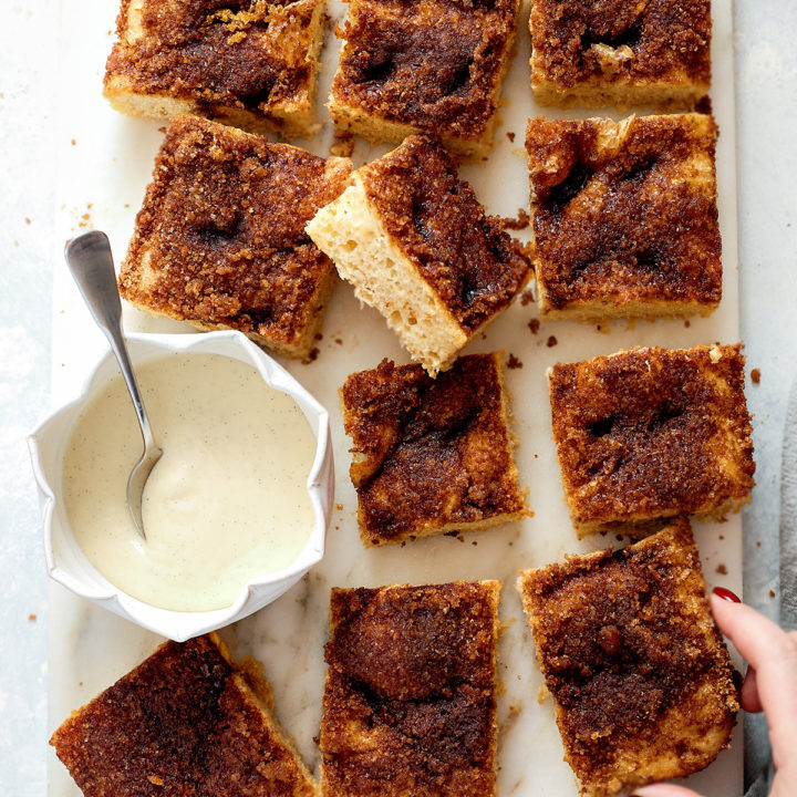 This cinnamon sugar focaccia is soft, bubbly, and layered with buttery cinnamon sugar and finished with a bourbon cream cheese glaze for the perfect sweet breakfast focaccia. It has all the flavors of cinnamon rolls in an easy, shareable focaccia-style bake. Ideal for holiday mornings, brunch, or make-ahead breakfasts. Includes step-by-step dough instructions and glaze options.