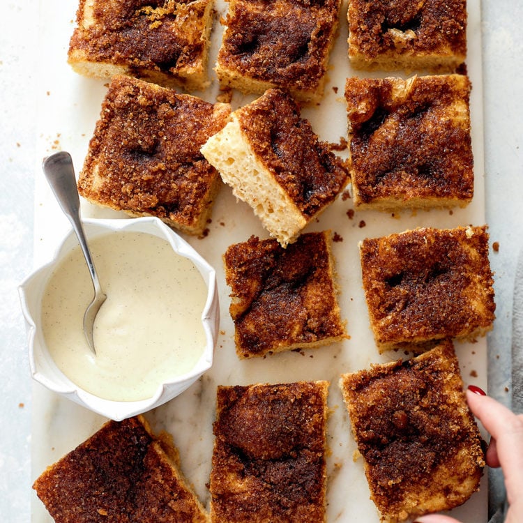 This cinnamon sugar focaccia is soft, bubbly, and layered with buttery cinnamon sugar and finished with a bourbon cream cheese glaze for the perfect sweet breakfast focaccia. It has all the flavors of cinnamon rolls in an easy, shareable focaccia-style bake. Ideal for holiday mornings, brunch, or make-ahead breakfasts. Includes step-by-step dough instructions and glaze options.